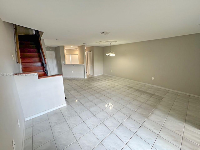 12873 SW 65th Ter, Miami, FL 33183 - unfurnished living room featuring stairway, light tile patterned flooring, a chandelier, and baseboards