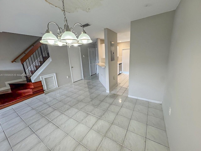 12873 SW 65th Ter, Miami, FL 33183 - unfurnished living room with a chandelier, light tile patterned flooring, and stairs