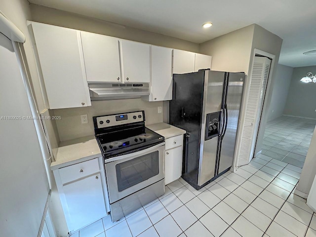12873 SW 65th Ter, Miami, FL 33183 - kitchen featuring under cabinet range hood, stainless steel appliances, light countertops, white cabinetry, and light tile patterned floors
