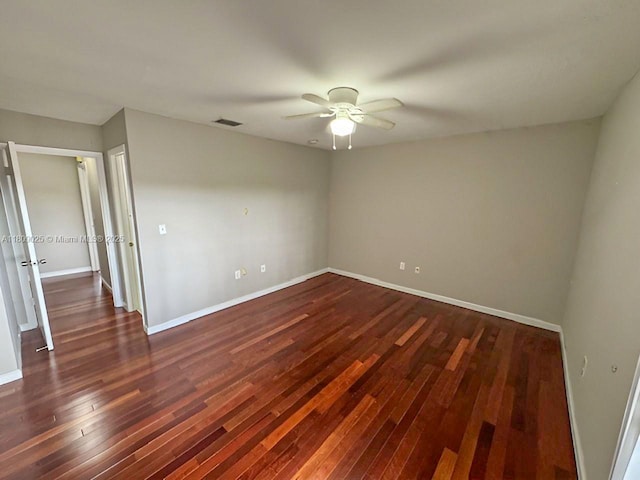 12873 SW 65th Ter, Miami, FL 33183 - spare room with a ceiling fan, dark wood-style floors, and baseboards