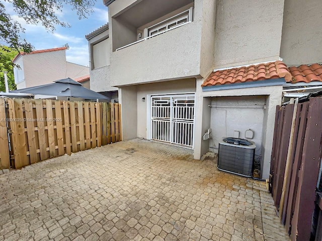 12873 SW 65th Ter, Miami, FL 33183 - view of patio / terrace featuring cooling unit