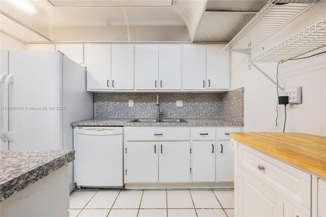 6821 SW 147th Ave Unit 1F, Miami, FL 33193 - kitchen with white appliances, a sink, white cabinetry, and backsplash