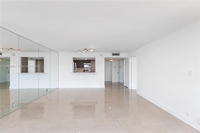 1901 Brickell Ave Unit B1903, Miami, FL 33129 - tiled spare room with rail lighting and baseboards