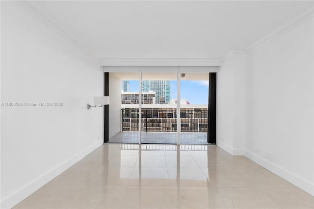 1901 Brickell Ave Unit B1903, Miami, FL 33129 - empty room with a wall of windows, crown molding, tile patterned flooring, baseboards, and a view of city