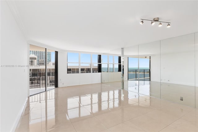1901 Brickell Ave Unit B1903, Miami, FL 33129 - unfurnished room featuring a wall of windows and light tile patterned floors