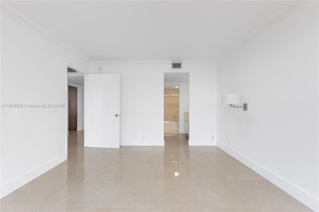 1901 Brickell Ave Unit B1903, Miami, FL 33129 - unfurnished room featuring crown molding, baseboards, and light tile patterned flooring