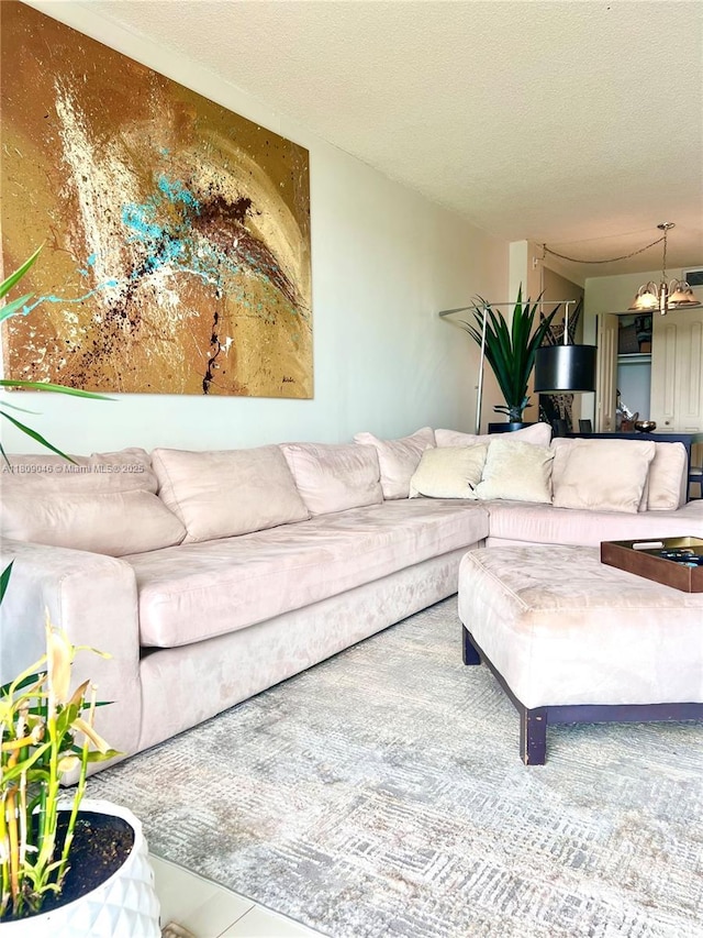 100 Bayview Dr Unit 1919, Sunny Isles Beach, FL 33160 - living room featuring a chandelier and a textured ceiling