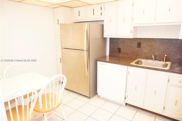 100 Bayview Dr Unit 1919, Sunny Isles Beach, FL 33160 - kitchen featuring white appliances, a sink, tasteful backsplash, white cabinets, and dark countertops