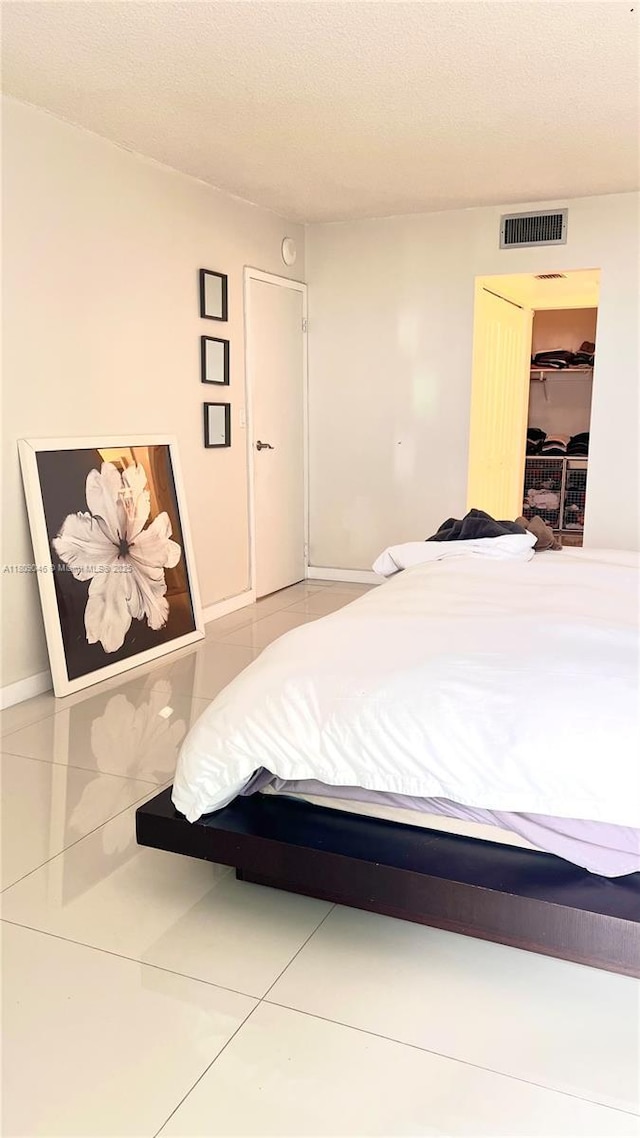 100 Bayview Dr Unit 1919, Sunny Isles Beach, FL 33160 - tiled bedroom with baseboards
