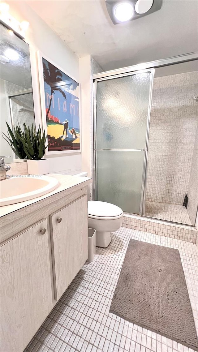 100 Bayview Dr Unit 1919, Sunny Isles Beach, FL 33160 - bathroom featuring vanity, a stall shower, and tile patterned floors