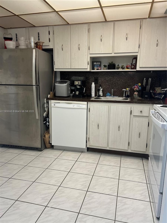 100 Bayview Dr Unit 1919, Sunny Isles Beach, FL 33160 - kitchen with white appliances, backsplash, dark countertops, and open shelves