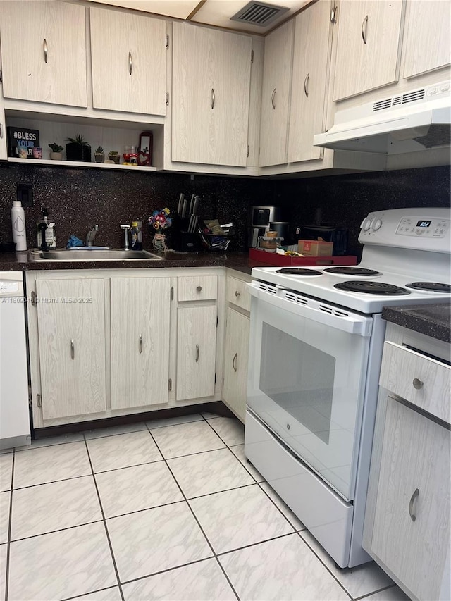 100 Bayview Dr Unit 1919, Sunny Isles Beach, FL 33160 - kitchen featuring white appliances, under cabinet range hood, dark countertops, and open shelves