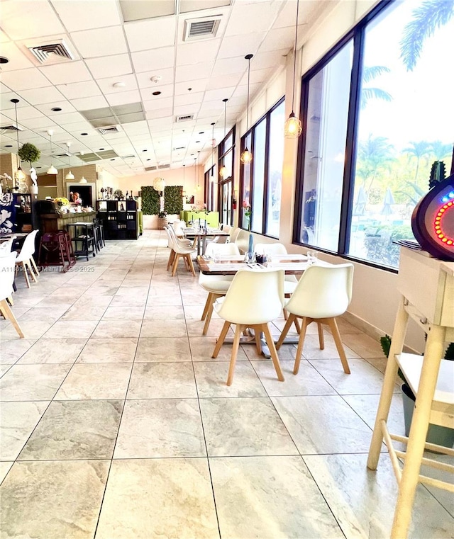 100 Bayview Dr Unit 1919, Sunny Isles Beach, FL 33160 - dining space featuring a paneled ceiling and light tile patterned flooring