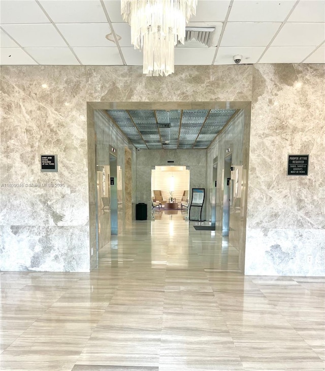 100 Bayview Dr Unit 1919, Sunny Isles Beach, FL 33160 - lobby with a paneled ceiling and tile walls