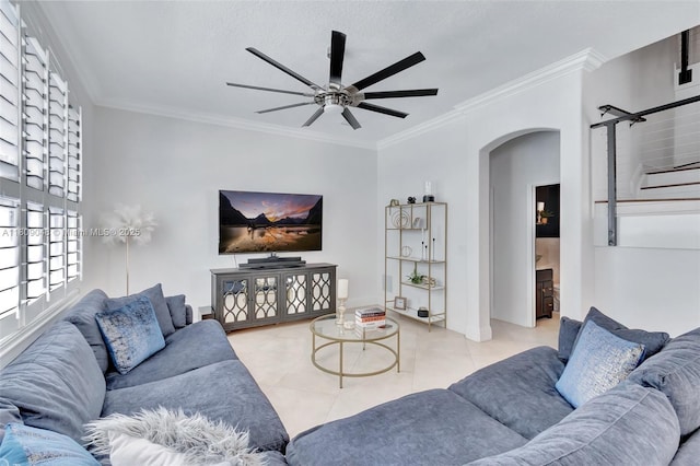 4231 N Magnolia Cir, Delray Beach, FL 33445 - tiled living room featuring arched walkways, ceiling fan, and ornamental molding