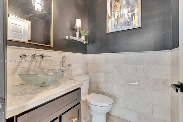 4231 N Magnolia Cir, Delray Beach, FL 33445 - half bathroom with tile walls, toilet, and vanity