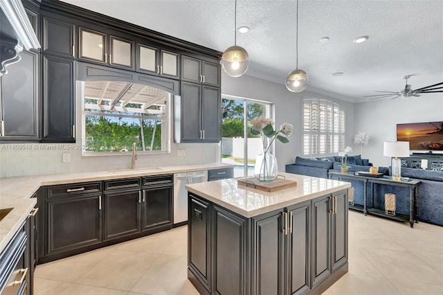 4231 N Magnolia Cir, Delray Beach, FL 33445 - kitchen with dishwasher, a sink, light tile patterned floors, tasteful backsplash, and a textured ceiling