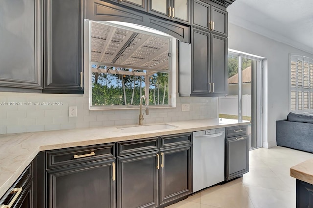 4231 N Magnolia Cir, Delray Beach, FL 33445 - kitchen with stainless steel dishwasher, a sink, backsplash, light stone counters, and ornamental molding