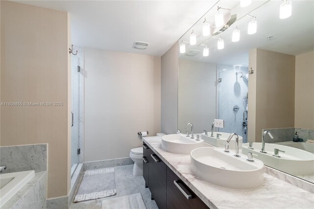 244 Biscayne Blvd Unit 3703, Miami, FL 33132 - full bathroom featuring a shower stall, a garden tub, double vanity, and toilet