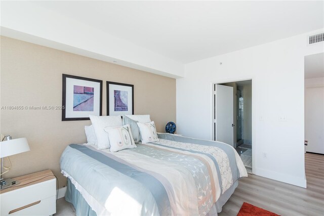 244 Biscayne Blvd Unit 3703, Miami, FL 33132 - bedroom featuring light wood-style flooring and baseboards
