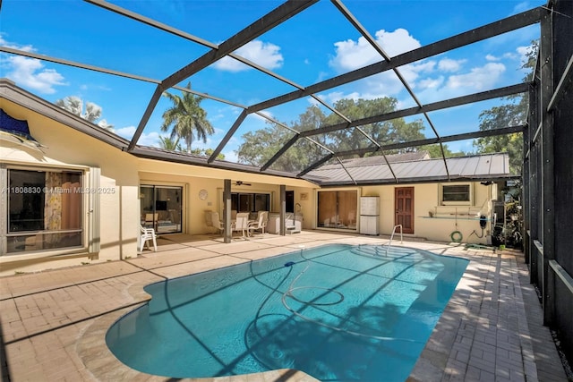 3721 N Park Rd, Hollywood, FL 33021 - outdoor pool featuring a patio area, ceiling fan, and glass enclosure