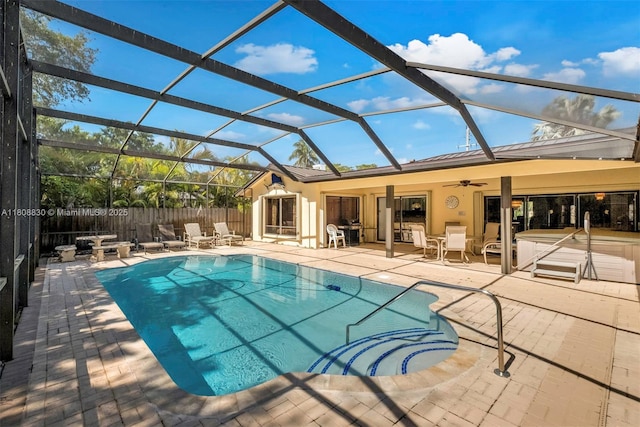 3721 N Park Rd, Hollywood, FL 33021 - view of swimming pool with a ceiling fan, a patio area, glass enclosure, and a hot tub