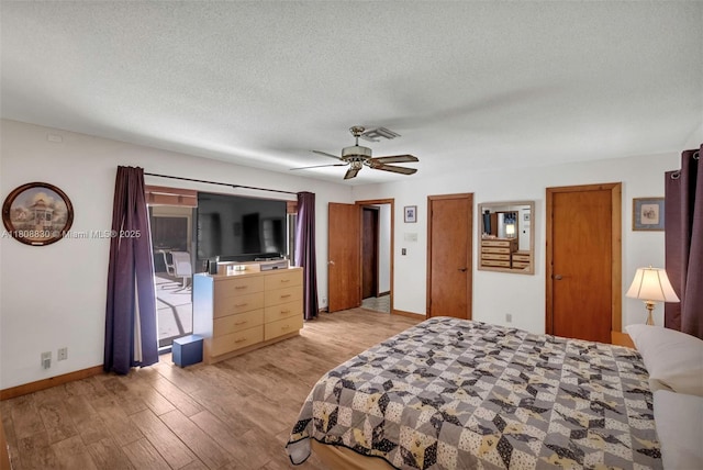 3721 N Park Rd, Hollywood, FL 33021 - bedroom featuring light wood finished floors, baseboards, a textured ceiling, and a ceiling fan