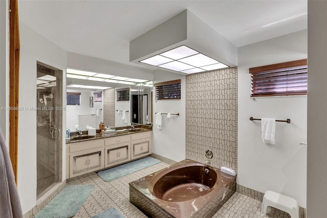 3721 N Park Rd, Hollywood, FL 33021 - full bathroom with a bath, double vanity, a stall shower, and tile patterned flooring