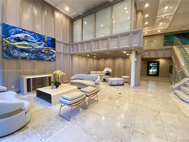 251 Crandon Blvd Unit 904, Key Biscayne, FL 33149 - building lobby featuring a decorative wall, a high ceiling, and stairs