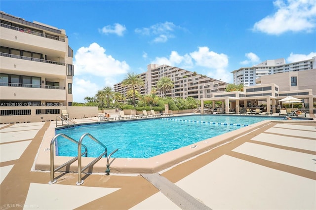 251 Crandon Blvd Unit 904, Key Biscayne, FL 33149 - community pool featuring a patio area
