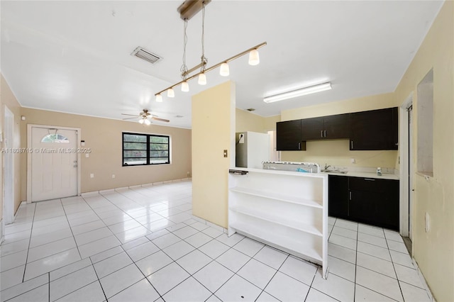778 NW 146th St, Miami, FL 33168 - kitchen with dark cabinets, light countertops, open shelves, ceiling fan, and light tile patterned flooring