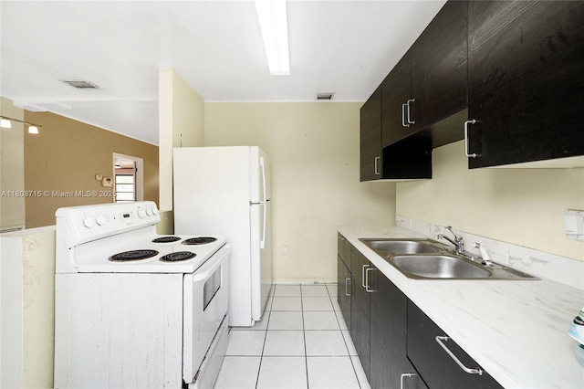 778 NW 146th St, Miami, FL 33168 - kitchen featuring white appliances, a sink, light countertops, dark cabinetry, and light tile patterned flooring