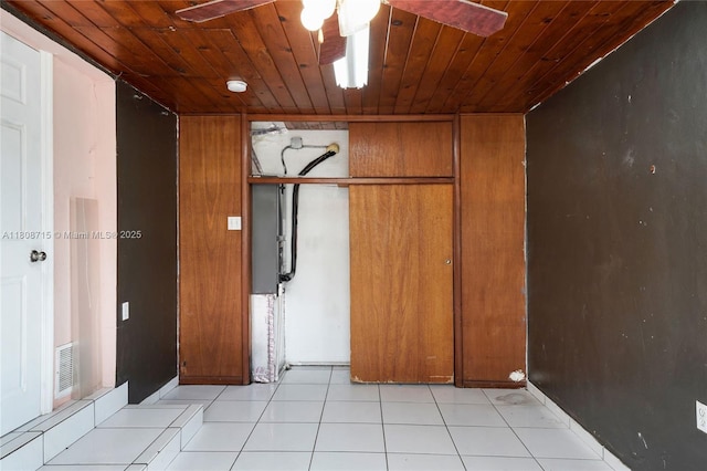 778 NW 146th St, Miami, FL 33168 - empty room with a ceiling fan, wood ceiling, and light tile patterned floors