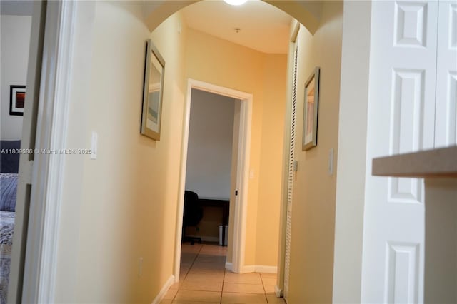 4506 SW 160th Ave Unit 1116, Miramar, FL 33027 - corridor featuring light tile patterned floors, arched walkways, and baseboards