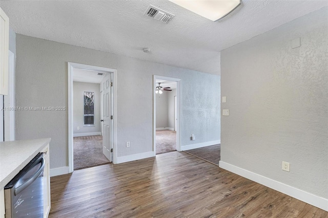 22123 SW 62nd Ct, Boca Raton, FL 33428 - unfurnished living room with wood finished floors, ceiling fan, baseboards, a textured wall, and a textured ceiling