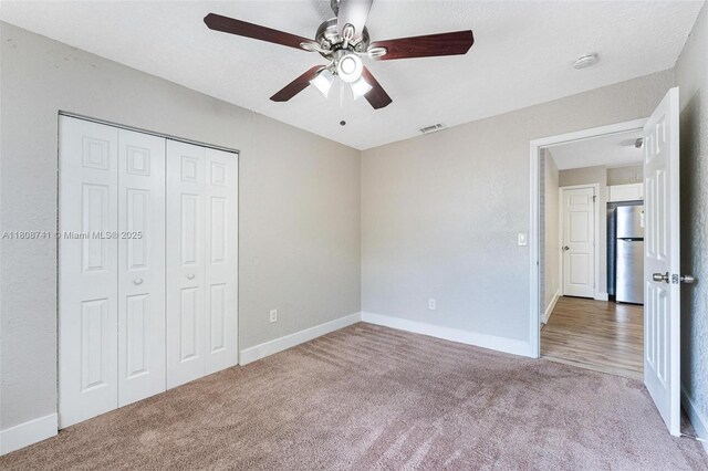 22123 SW 62nd Ct, Boca Raton, FL 33428 - unfurnished bedroom featuring freestanding refrigerator, carpet floors, a closet, baseboards, and a ceiling fan