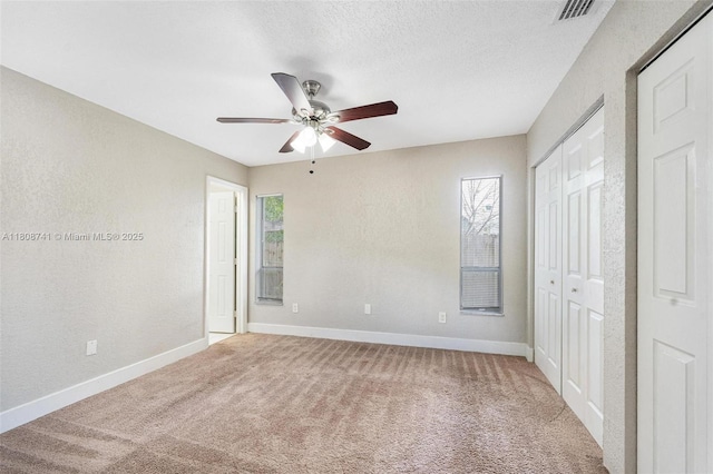 22123 SW 62nd Ct, Boca Raton, FL 33428 - unfurnished bedroom featuring carpet, baseboards, a ceiling fan, a textured wall, and a closet