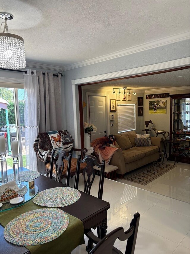 7430 Buchanan St, Hollywood, FL 33024 - tiled dining space featuring ornamental molding, a textured ceiling, and a chandelier