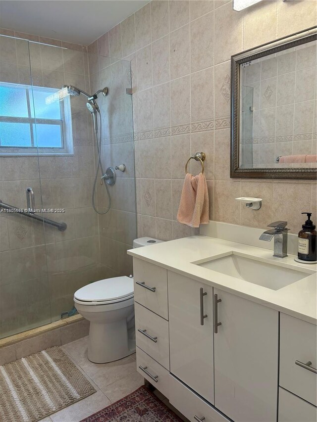 7430 Buchanan St, Hollywood, FL 33024 - bathroom featuring tile walls, vanity, a shower stall, and tile patterned floors