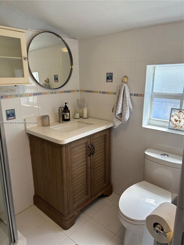 7430 Buchanan St, Hollywood, FL 33024 - bathroom featuring tile walls, vanity, tasteful backsplash, and tile patterned floors