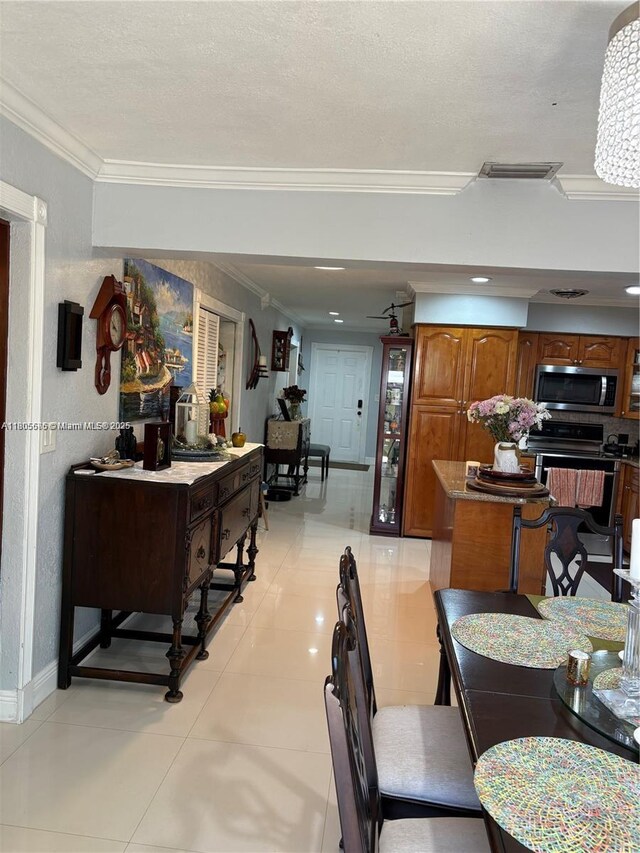 7430 Buchanan St, Hollywood, FL 33024 - kitchen with stainless steel appliances, brown cabinets, backsplash, glass insert cabinets, and ornamental molding