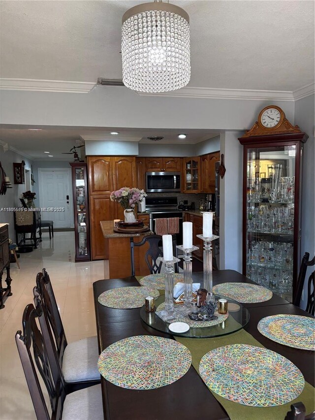 7430 Buchanan St, Hollywood, FL 33024 - dining space with a chandelier, crown molding, and recessed lighting