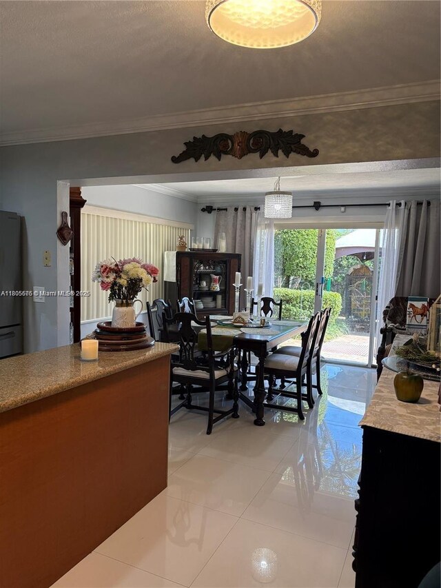 7430 Buchanan St, Hollywood, FL 33024 - dining room with light tile patterned floors and ornamental molding