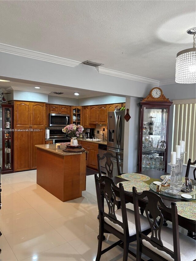 7430 Buchanan St, Hollywood, FL 33024 - tiled dining room featuring crown molding