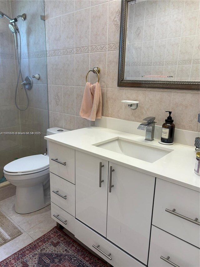 7430 Buchanan St, Hollywood, FL 33024 - bathroom featuring tile walls, vanity, a tile shower, tile patterned floors, and decorative backsplash