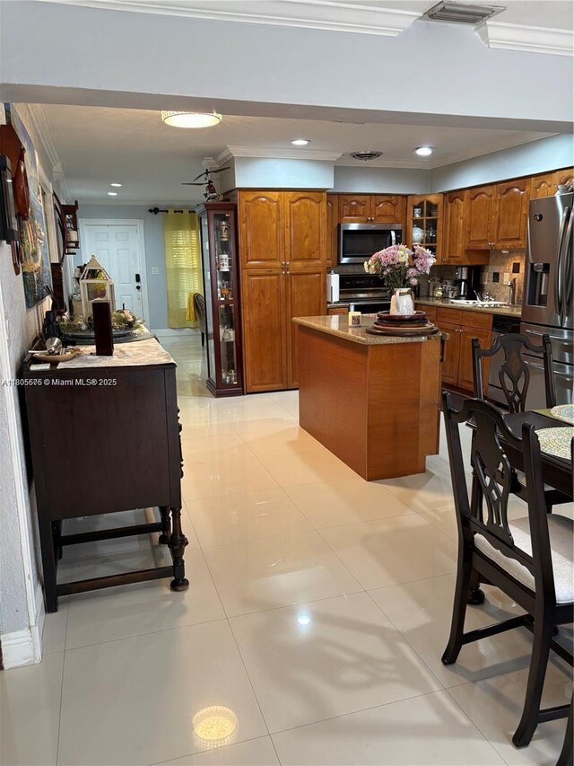 7430 Buchanan St, Hollywood, FL 33024 - bathroom featuring tile walls, vanity, a tile shower, tile patterned floors, and decorative backsplash
