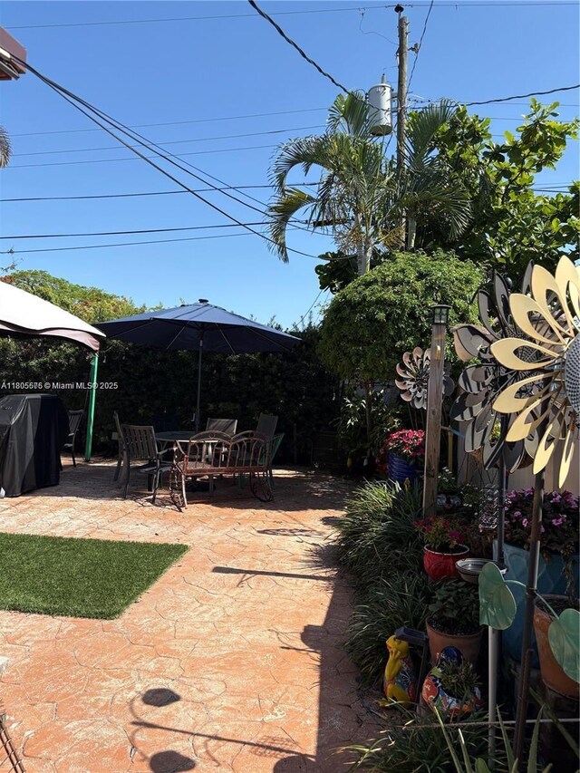 7430 Buchanan St, Hollywood, FL 33024 - view of yard with a patio area, a gazebo, and outdoor dining area