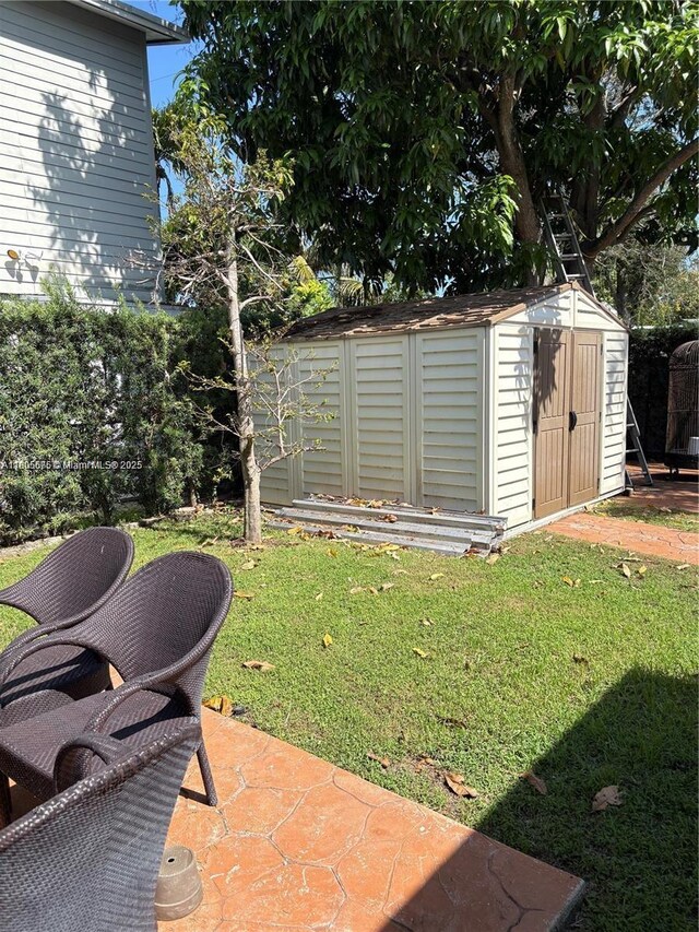 7430 Buchanan St, Hollywood, FL 33024 - view of grassy yard with a storage unit