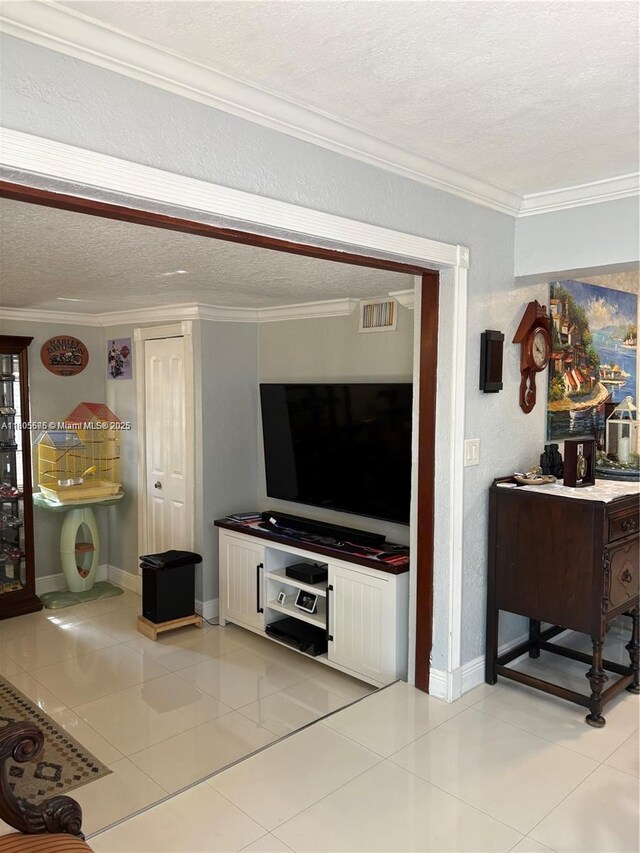 7430 Buchanan St, Hollywood, FL 33024 - living room with crown molding, a textured ceiling, and light tile patterned floors