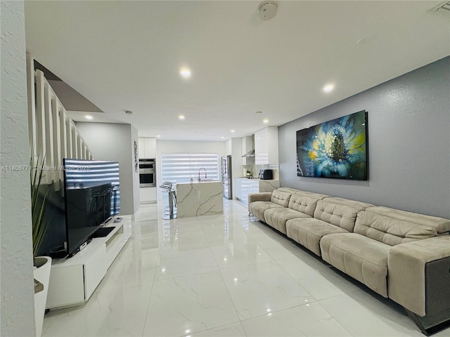 13729 SW 171st Ln, Miami, FL 33177 - living area with light marble finish floors, recessed lighting, and a textured wall